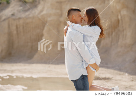 Young couple in love in sand career Young couple in love in sand career 79496602
