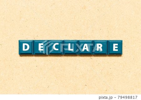Tile alphabet letter in word declare on wood background Tile alphabet letter in word declare on wood background 79498817