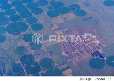 Aerial view from a airplane of agriculture circled fields in the desert near Denver, Colorado, USA 79508117