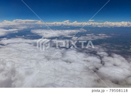 Overview in desert Arizona from the plane of fluffy clouds in mountains an airplane Overview in desert Arizona from the plane of fluffy clouds in mountains an airplane 79508118