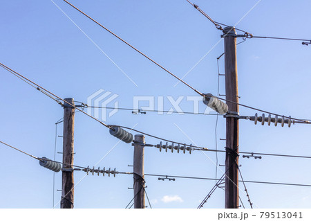 Photograph of a wooden telephone post and cables Photograph of a wooden telephone post and cables 79513041