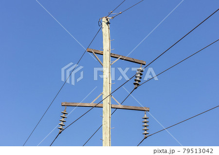 Photograph of a wooden telephone post and cables 79513042