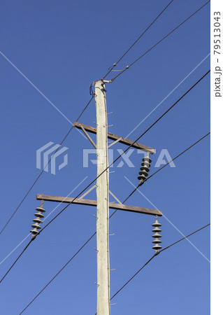 Photograph of a wooden telephone post and cables 79513043