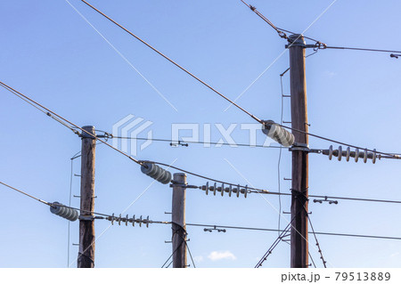 Photograph of a wooden telephone post and cables Photograph of a wooden telephone post and cables 79513889