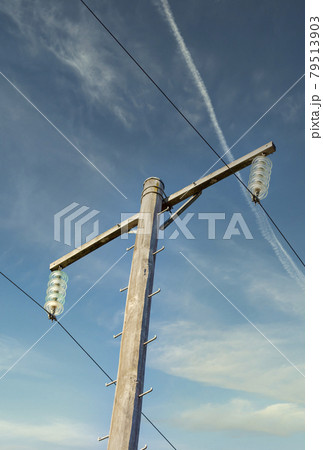 Photograph of a wooden telephone post and cables 79513903