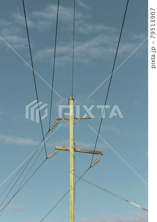 Photograph of a wooden telephone post and cables Photograph of a wooden telephone post and cables 79513907