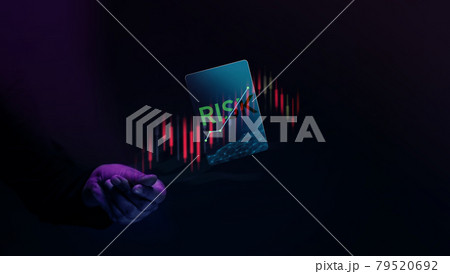 Risk of Stock Market Share Investment Concept. Investor Flick and Levitating a Card of Risk. Take or Lose Profit. surrounded by Stock Marketing Graph. Dark tone 79520692