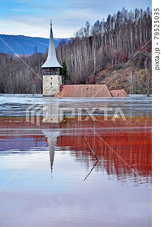 Abandoned church in the middle of a lake full with mining residuals Abandoned church in the middle of a lake full with mining residuals 79525035