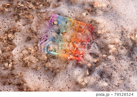 sea water and foam covered the Pop it toy. sea water and foam covered the Pop it toy. 79526524