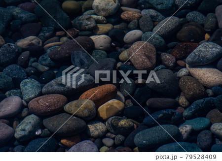 Beach stones as a background 79528409