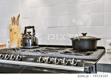 Interior of a beautiful kitchen of an elite house Interior of a beautiful kitchen of an elite house 79529165