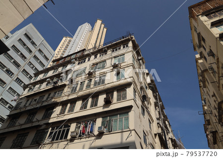 10 April 2021 Local city street scene with high density traditional residential buildings 79537720