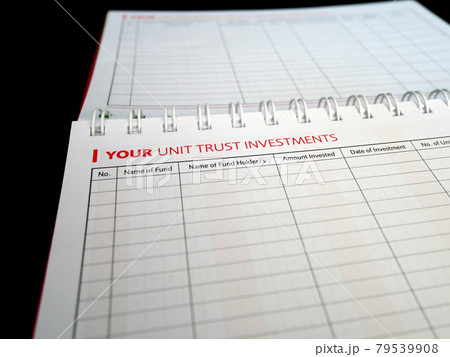 Selected focused on Unit Trust Investment text found on one page of a notebook. Be the title to a table of unit trust investment schedules that is still empty. Selected focused on Unit Trust Investment text found on one page of a notebook. Be the title to a table of unit trust investment schedules that is still empty. 79539908