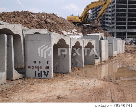 SELANGOR, MALAYSIA -DECEMBER 02, 2016: Precast concrete box culvert drain stacked at the construction site. It is used to channel storm water to the nearest monsoon drain.  79540741
