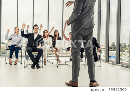 Businesswomen and businessmen in group meeting. Businesswomen and businessmen in group meeting. 79541560