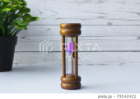 Hourglass as time passing concept for business deadline and running out of time Hourglass as time passing concept for business deadline and running out of time 79542422