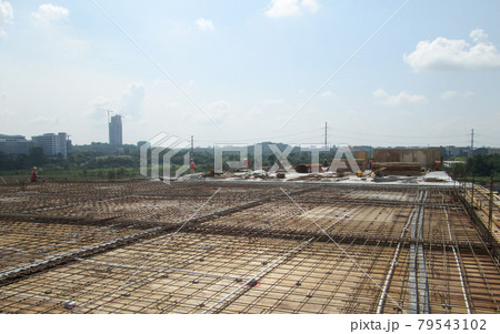 SELANGOR, MALAYSIA -MAY 13, 2016: Steel reinforcement bar at the construction site to form steel reinforced concrete slab. It use to strengthen the concrete. It is shaped follow the engineer design. SELANGOR, MALAYSIA -MAY 13, 2016: Steel reinforcement bar at the construction site to form steel reinforced concrete slab. It use to strengthen the concrete. It is shaped follow the engineer design. 79543102