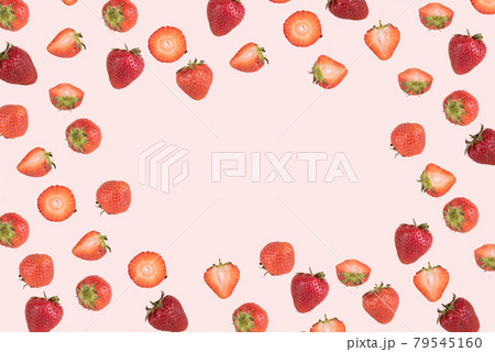 Trendy pattern of whole and cut strawberries on a pink background with place for text. Trendy pattern of whole and cut strawberries on a pink background with place for text. 79545160