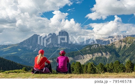 Sporty Young woman friends on mountain trail Dolomites Mountains, Italy Sporty Young woman friends on mountain trail Dolomites Mountains, Italy 79546578