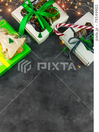 Christmas Gift boxes different dried fruits nuts candied citrus individually wrapped flat lay copy space.Winter holidays Christmas Gift boxes different dried fruits nuts candied citrus individually wrapped flat lay copy space.Winter holidays 79549902