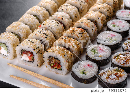Delicious fresh rolls in various sets. Japanese food with avocado, shrimp, crab and salmon Delicious fresh rolls in various sets. Japanese food with avocado, shrimp, crab and salmon 79551372