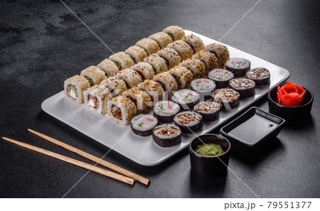 Delicious fresh rolls in various sets. Japanese food with avocado, shrimp, crab and salmon Delicious fresh rolls in various sets. Japanese food with avocado, shrimp, crab and salmon 79551377