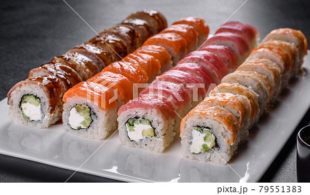Delicious fresh rolls in various sets. Japanese food with avocado, shrimp, crab and salmon Delicious fresh rolls in various sets. Japanese food with avocado, shrimp, crab and salmon 79551383