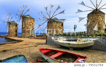 Authentic traditional Greece scenery - old windmills near the sea - landmark of Chios island Authentic traditional Greece scenery - old windmills near the sea - landmark of Chios island 79552704