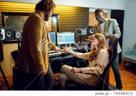 Male and female performers, recording studio 79586973