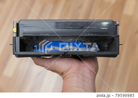 Dust Bin from robot vacuum cleaner with dirty dust powder and hair from the ground contain inside. 79590985