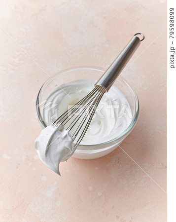 bowl of beaten egg whites 79598099