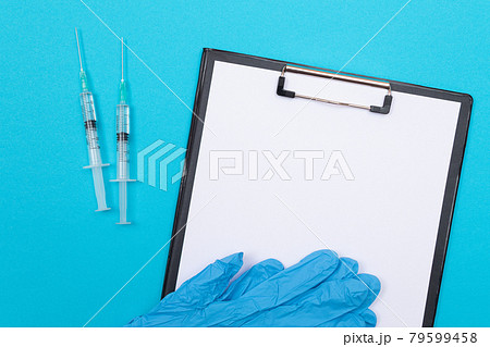 Vaccination or Revaccination Concept - Two Medical Syringe on Blue Table 79599458