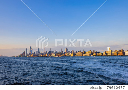 Sunny view of the famous Manhattan skyline Sunny view of the famous Manhattan skyline 79610477
