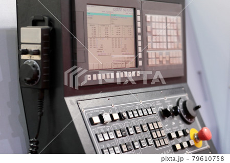CNC lathe machine control console close up 79610758