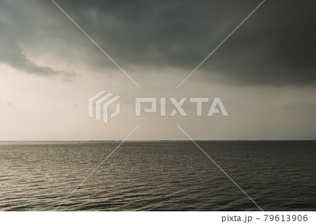 Sunset ocean with stormy cloud in the sky. 79613906
