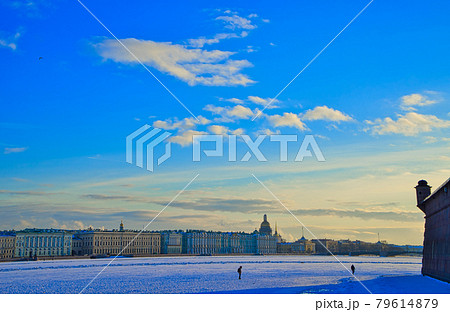 The Neva river in ice. Embankment of St. Petersburg with colorful neat buildings. 79614879
