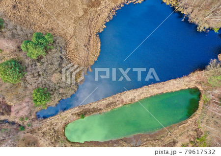 Aerial view of a lake in the German heath landscape, Vertical from great height Aerial view of a lake in the German heath landscape, Vertical from great height 79617532