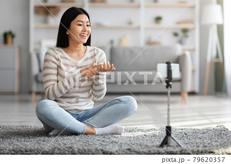 Video Blog. Smiling Asian Blogger Lady Recording Vlog At Home 79620357