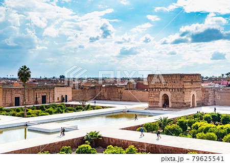 Tourist walking at El Badi Palace in Morocco Tourist walking at El Badi Palace in Morocco 79625541