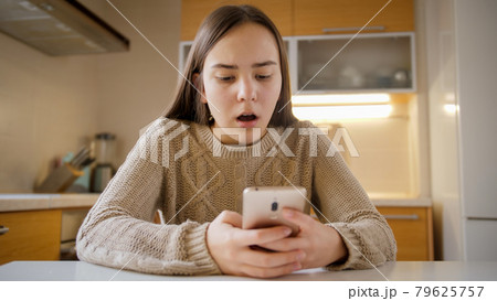 Teenage girl got upset and stressed after receiving negative information or abuse in social media Teenage girl got upset and stressed after receiving negative information or abuse in social media 79625757