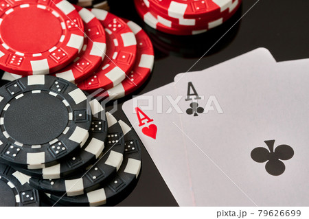 Casino chips and playing cards on dark reflective background 79626699