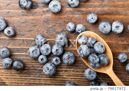 Fresh blueberries in a wooden spoon. Fresh blueberries in a wooden spoon. 79627972