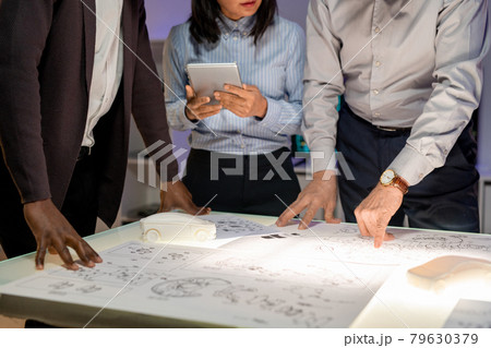 Discussing Innovative Solutions for New Car Discussing Innovative Solutions for New Car 79630379