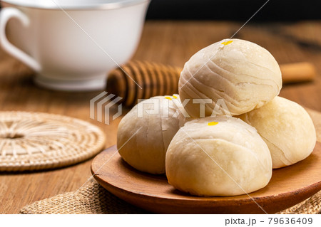 Closeup view of homemade chinese pastry or moon cake filled with sweet mung bean paste and salted egg yolk. Closeup view of homemade chinese pastry or moon cake filled with sweet mung bean paste and salted egg yolk. 79636409