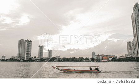 November 2019. Bangkok Thailand long tail boat serving people and tourist along Chao Phraya River November 2019. Bangkok Thailand long tail boat serving people and tourist along Chao Phraya River 79636532