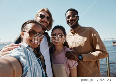 Group of Friends Taking Selfie Outdoors 79641231