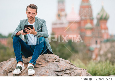 Happy young urban man in european city. Happy young urban man in european city. 79641574