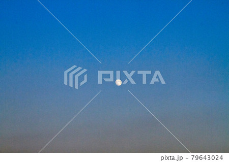 The moon over twilight evening sky background. The moon over twilight evening sky background. 79643024