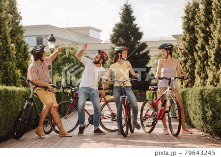 Group of cyclists having fun outdoors. 79643245