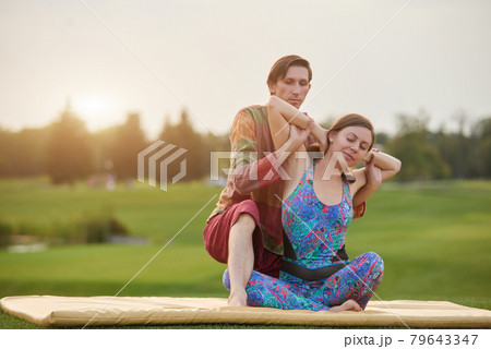 Thai massage yoga on the grass. 79643347
